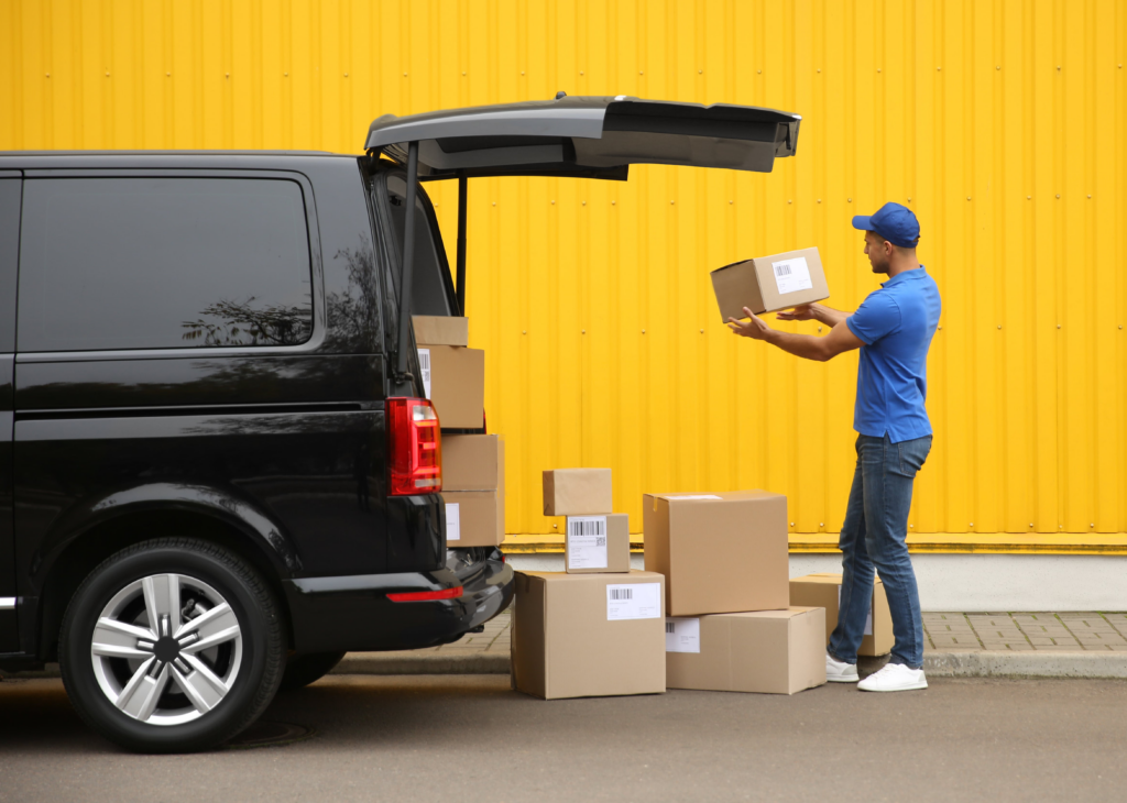 Man unloading a medium van