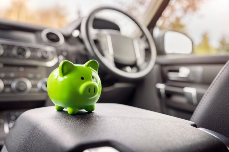 Image showing a piggy bank on a vehicle's seat