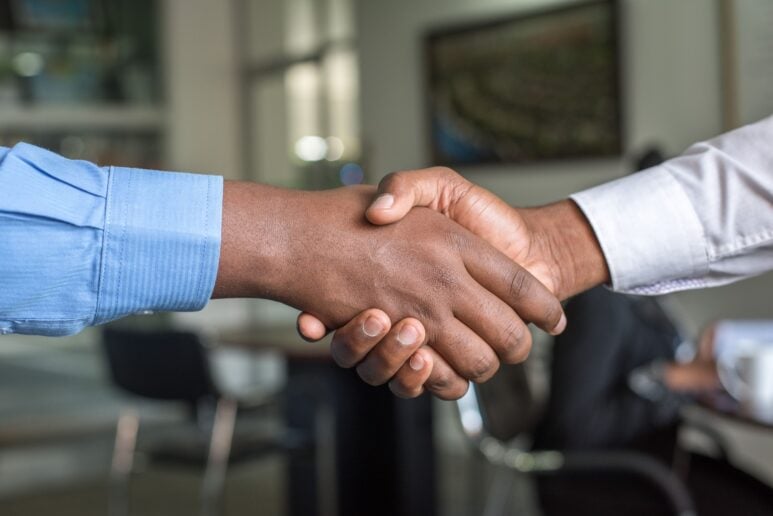 Consumer-duty-hero-image Two men shaking hands