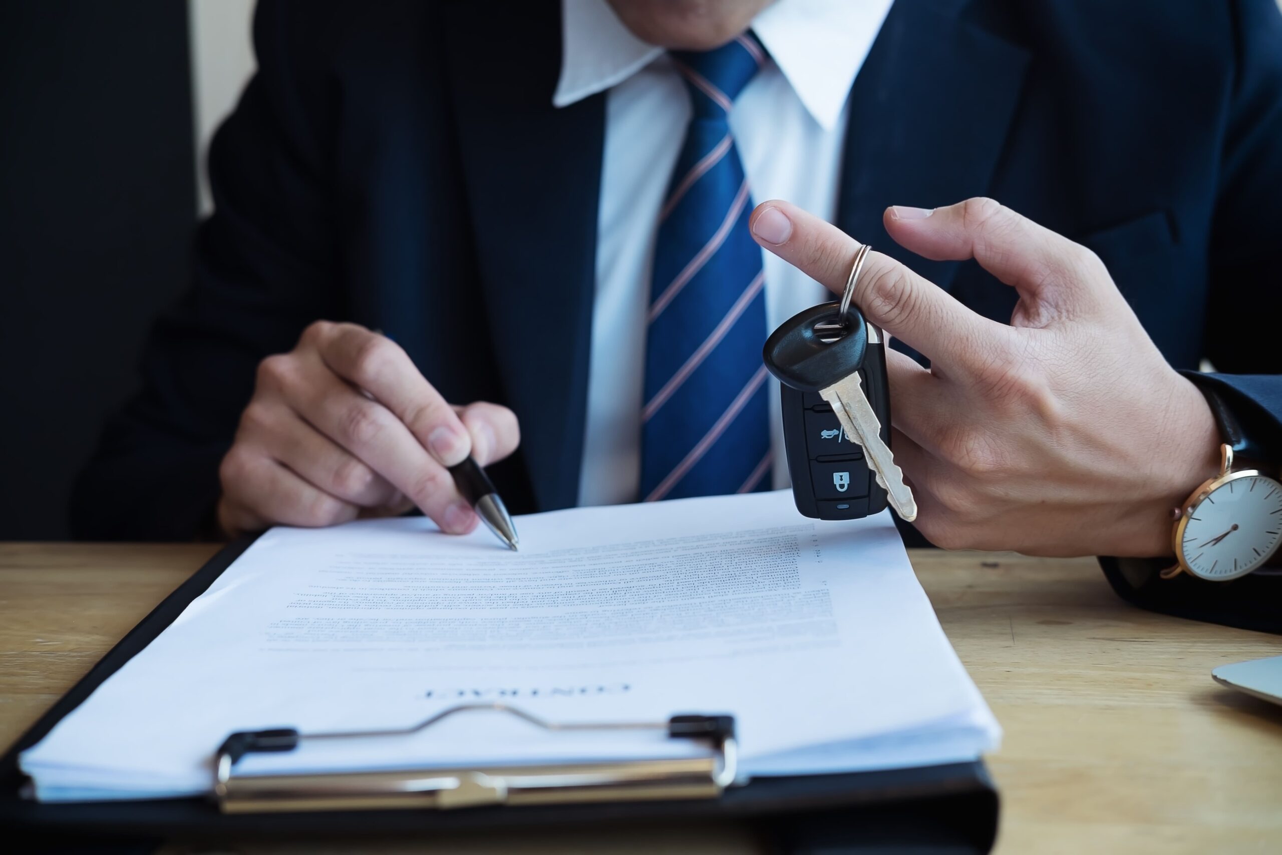 Image of a businessman signing van leasing contract