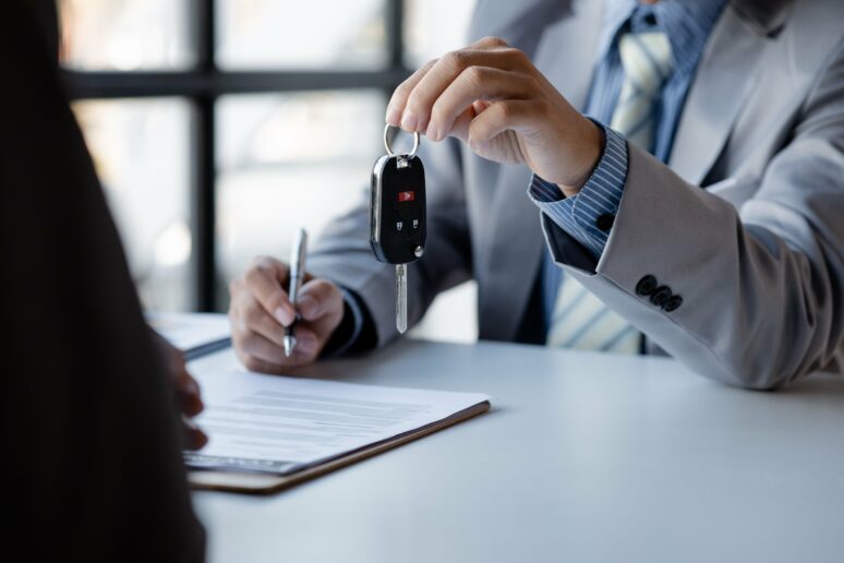 Business-van-lease-hero-image Image of a man receiving the keys to his lease business van from Commercial Vehicle Contracts, one of the top providers for van leasing in London.