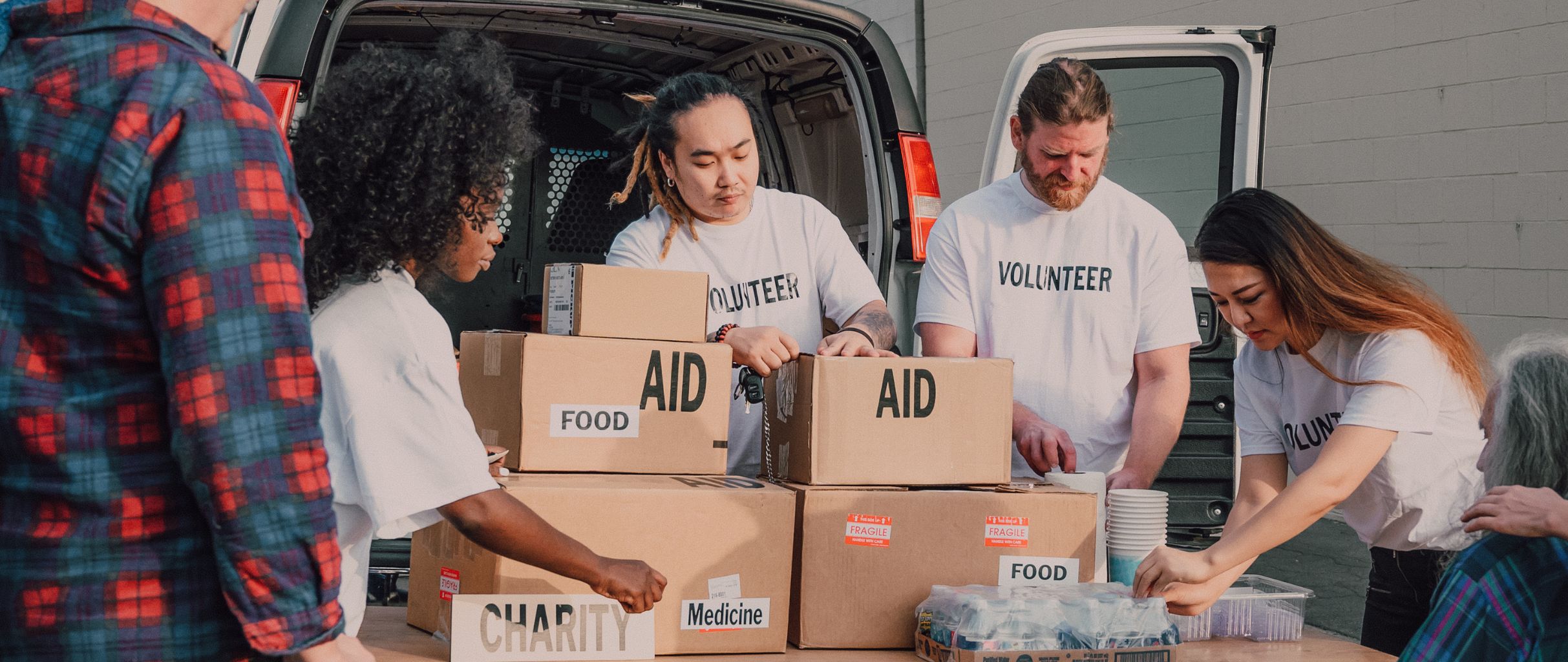 Charity volunteers unloading the van
