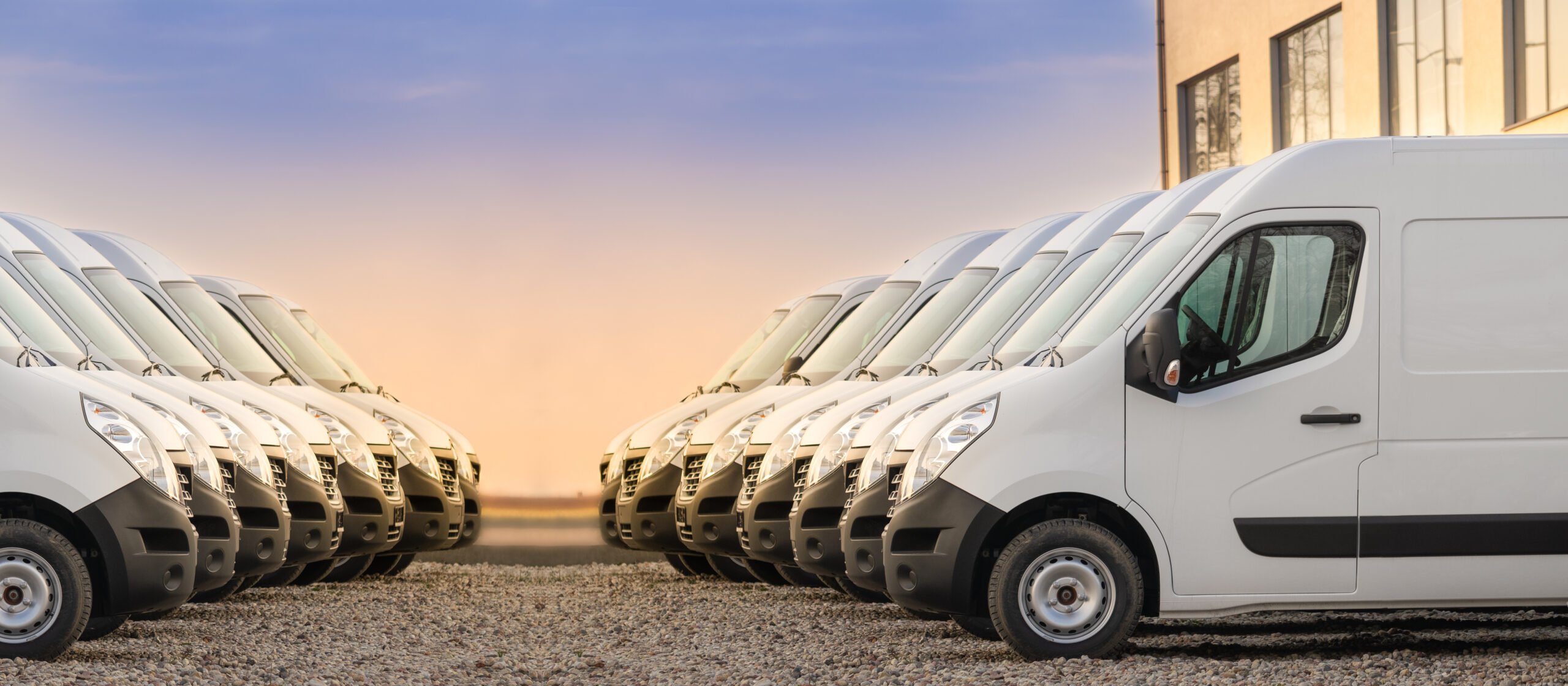 Commercial,Delivery,Vans,Parked,In,Two,Rows.,Transporting,Service,Company.