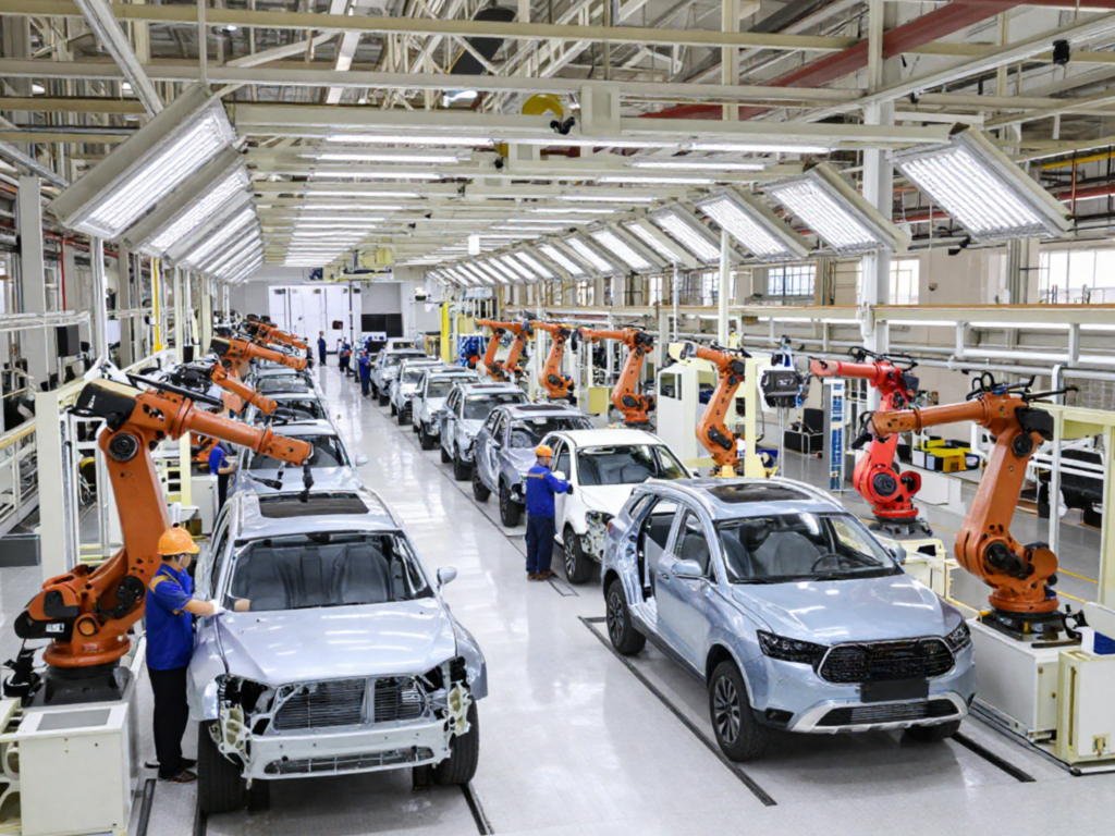 Chinese car factory scene showing workers on the production line